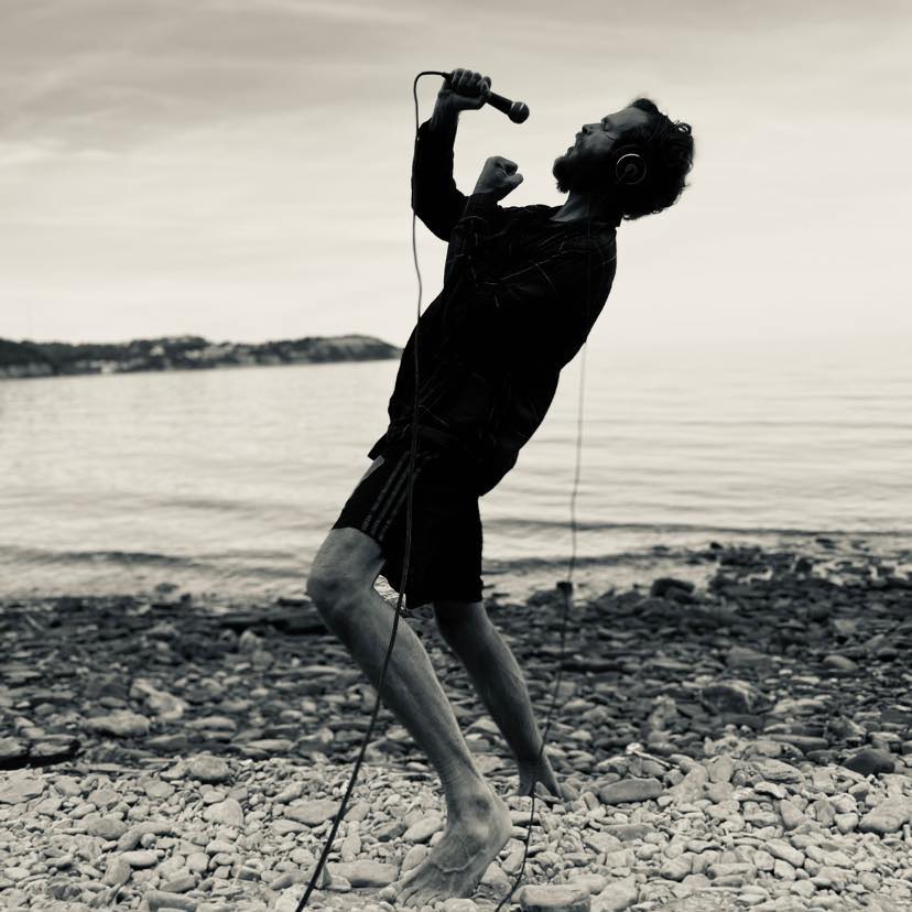 Klemen performing by the waterfront